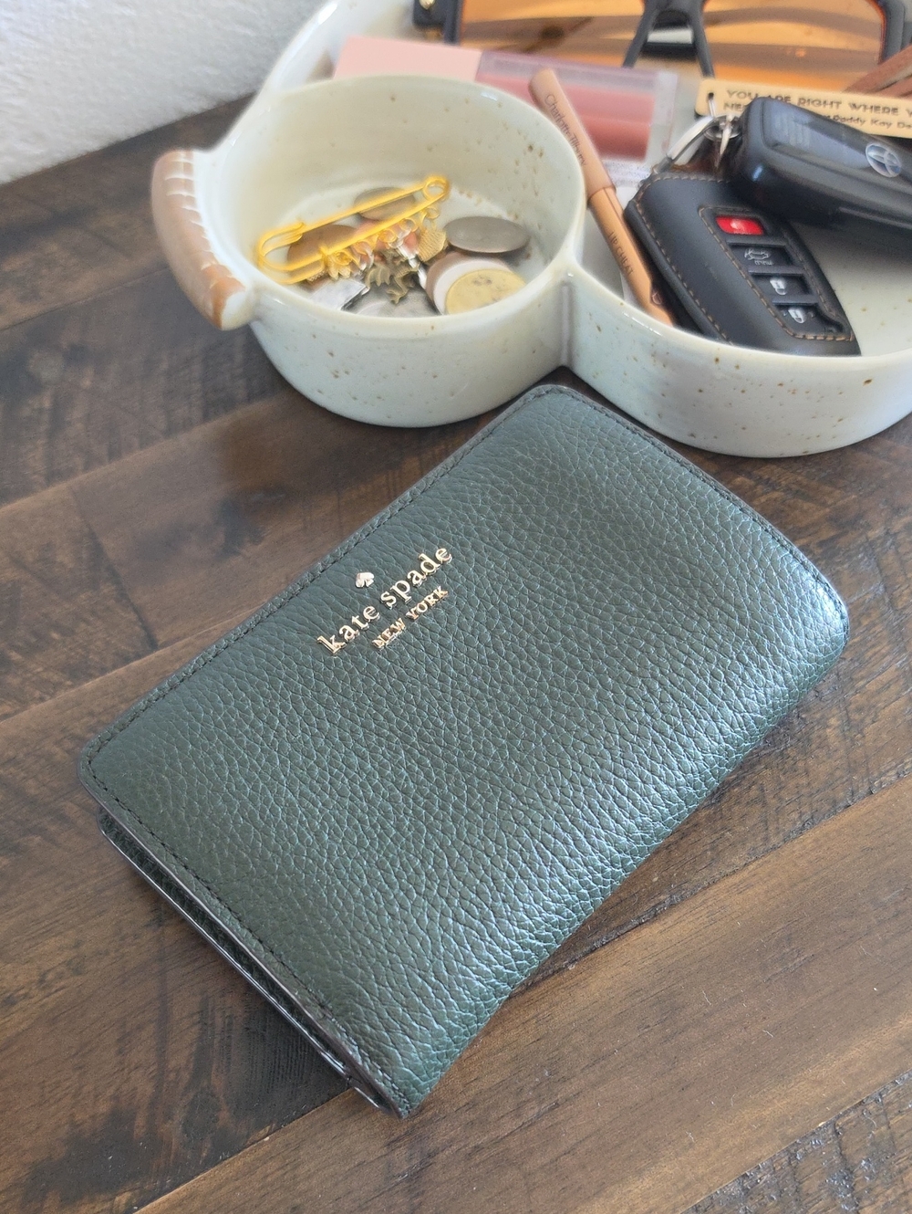 kate spade green pebble leather bifold wallet with gold logo
